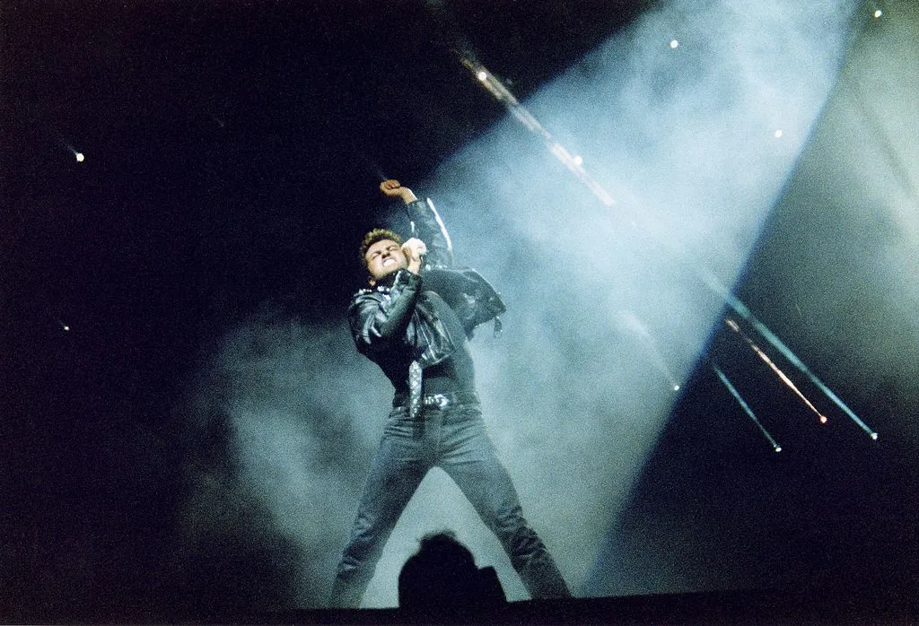 George Michael performs on stage during his tour 