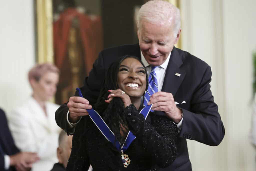 U.S. President Joe Biden presents the Presidential Medal of Freedom to Simone Biles, Olympic gold medal gymnast and mental health advocate, during a ceremony in the East Room of the White House July 7, 2022 in Washington, DC.