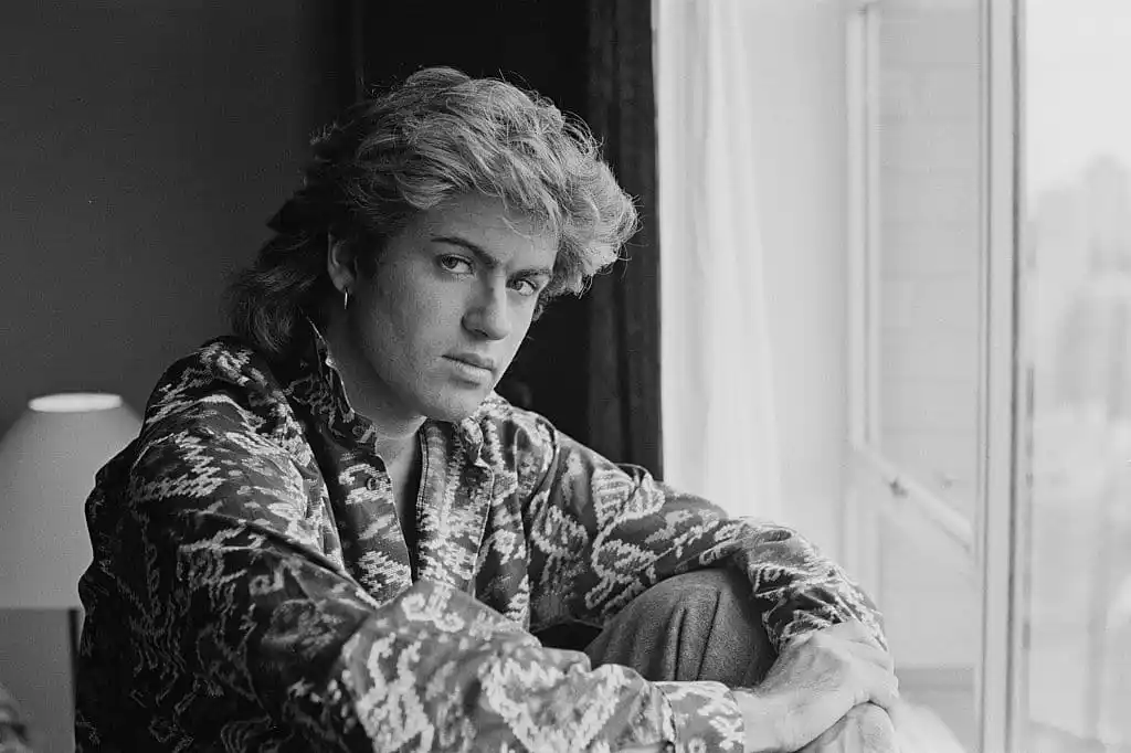 British singer-songwriter George Michael of Wham! in a Sydney hotel room during the pop duo's 1985 world tour. 