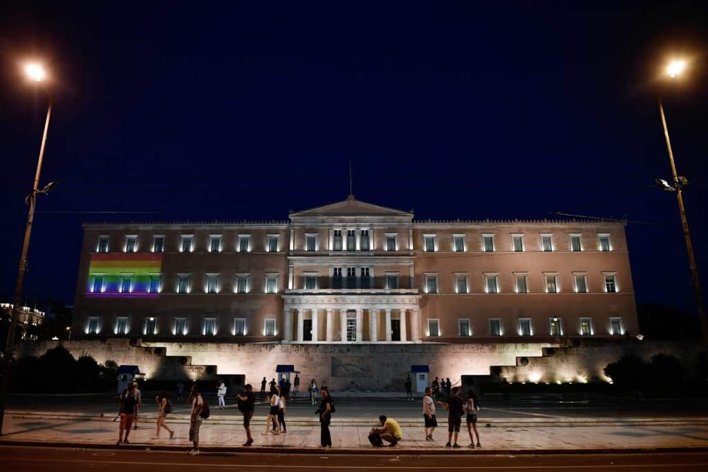 A rainbow flag is projected on the facade of the Greek parliament 
