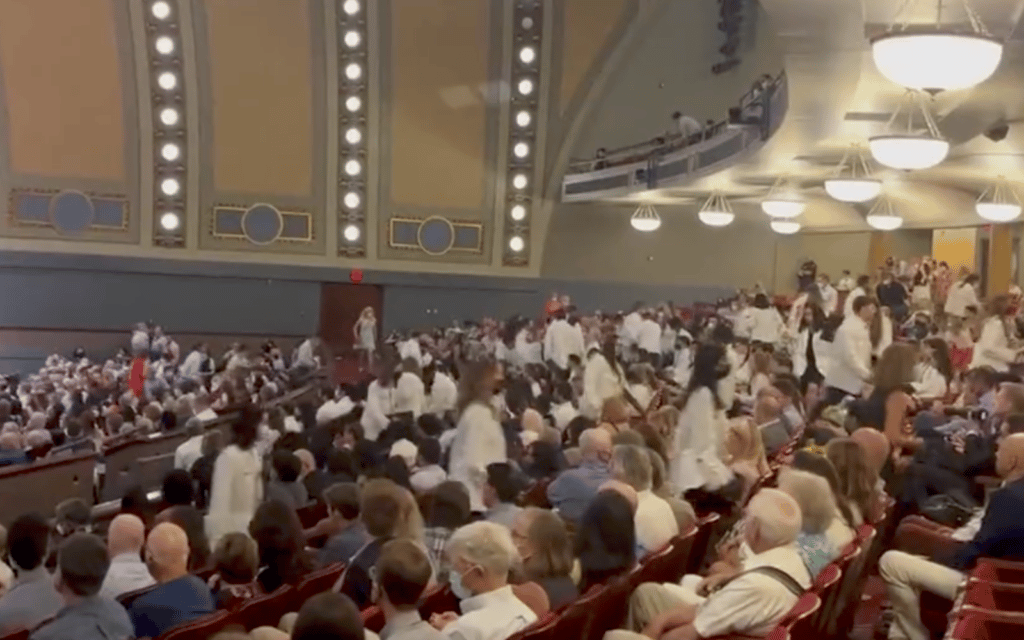 Students at the University of Michigan walk out of the white coat ceremony