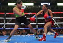 Eva Guzman (R) and Marlen Esparza (L) exchange punches